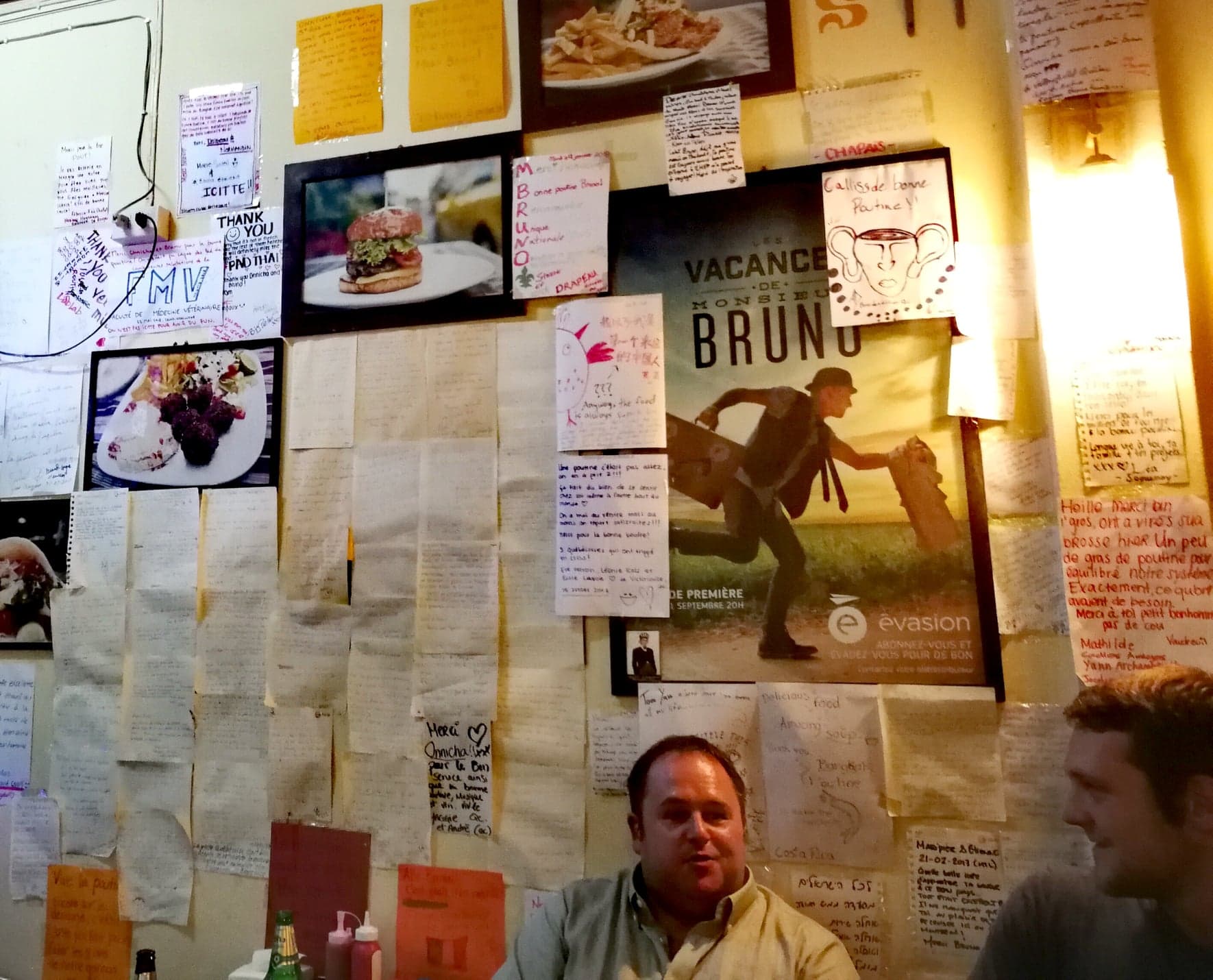 Notes on the wall alongside a poster for Blanchet's travel TV show. Photo: Laurel Tuohy/Coconuts