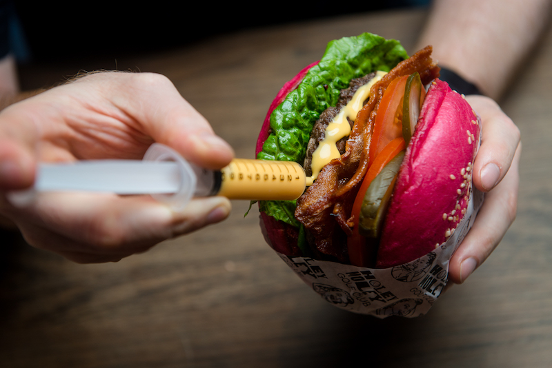 A cheese burger with questionable-looking buns. Photo: Holey Moley