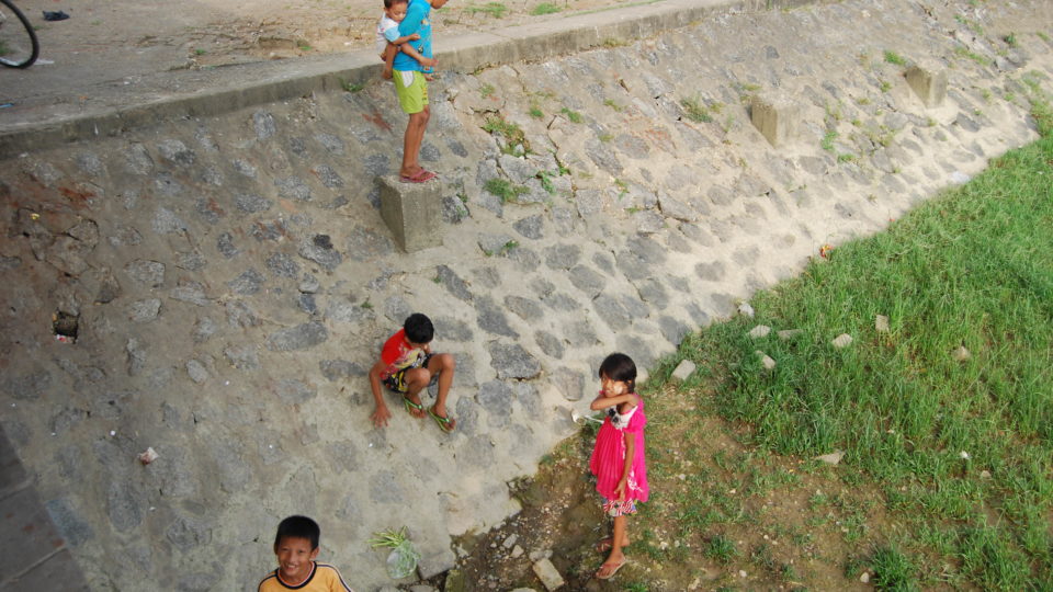 Children by the Yangon River.
