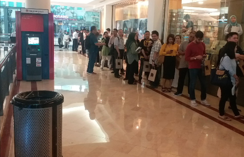 That queue went out the door around two corners, and looped back