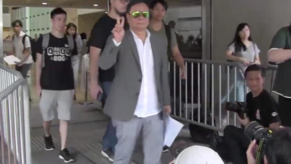 V for victory: ex-lawmaker Wong Yuk-man leaves court after winning his appeal against assaulting CY Leung Picture: Wong’s Facebook.