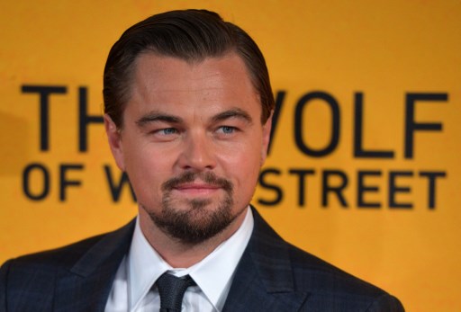 Leonardo DiCaprio poses on the red carpet as he arrives to attend the UK premiere of film 'The Wolf of Wall Street' in London on January 9, 2014. The film received significant funding from the 1MDB fun and DiCaprio himself received multiple personal gifts from Jho Low, which he subsequently returned amid the Department of Justice investigation. AFP PHOTO / Ben Stansalll