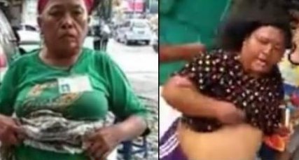 Unofficial parking attendants in the city of Medan flashing their underwear to a motorcyclist. Photo: Facebook