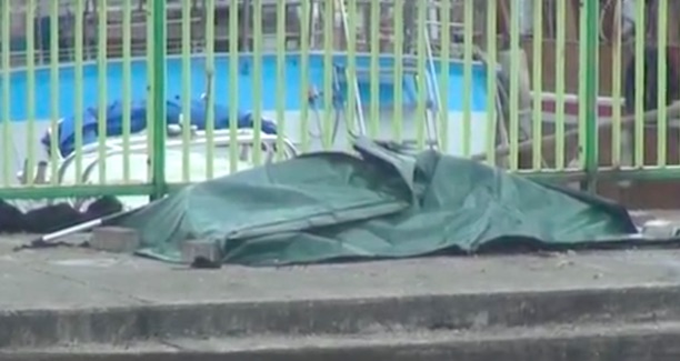 Bodybag containing the body of the middle-aged man found in the sea. Screengrab via Apple Daily video.