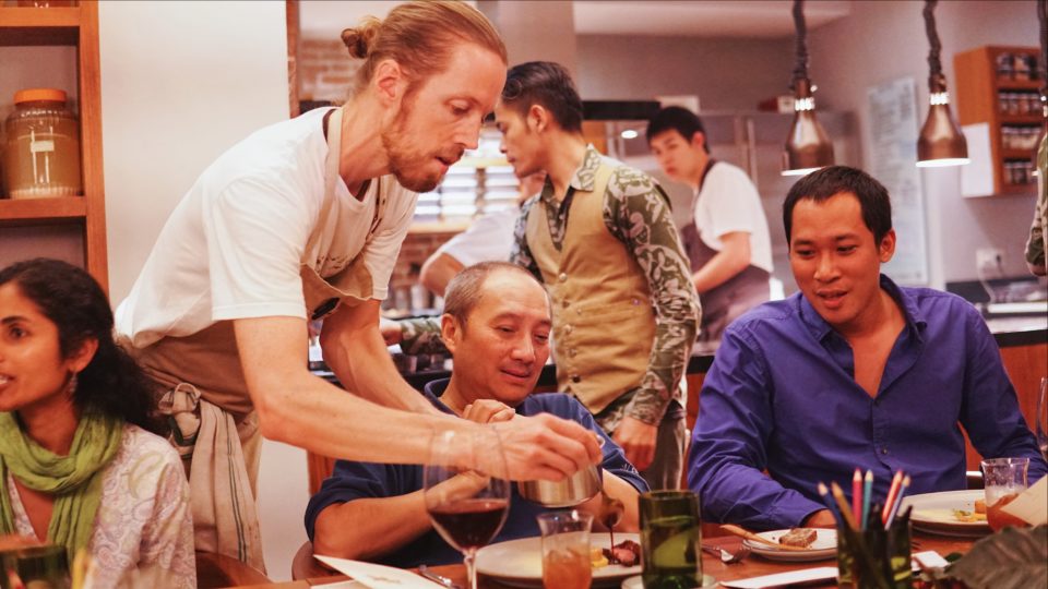 Chef Felix adds a cinnamon ginger glaze to a plate of duck at LocaLAB. Photo: Coconuts Bali