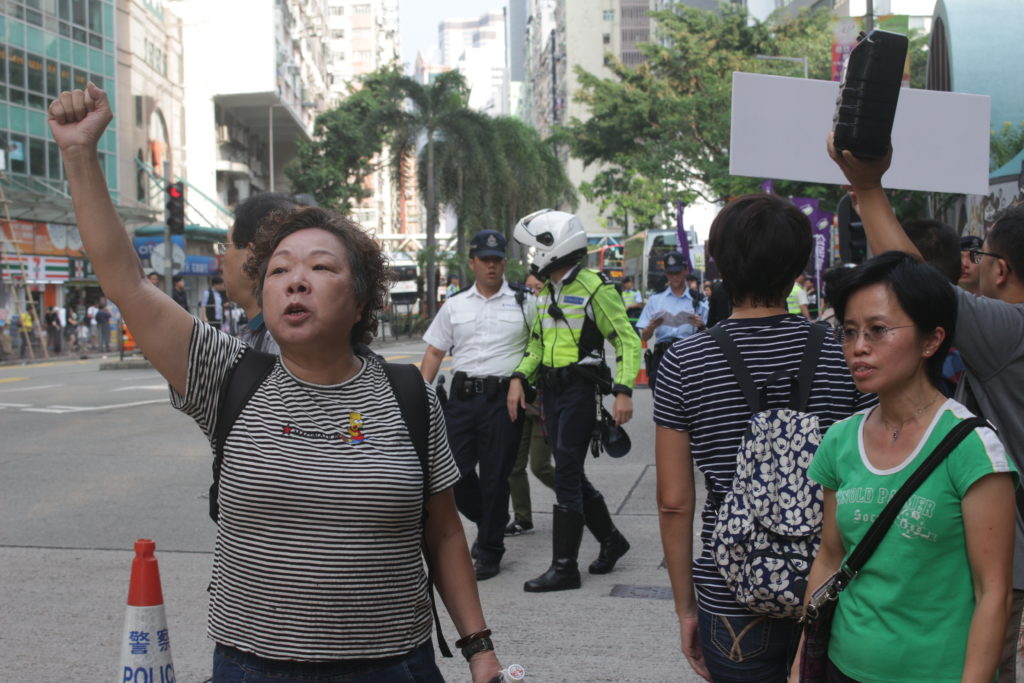 Pro-Beijing protester hijacks the 2018 national day rally in Wan Chai by yelling 'this is China'. Photo by Vicky wong.