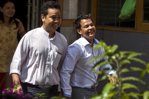 Detained Myanmar journalist Phyo Wai Win (R) leaves the court compound after a hearing in Yangon on October 26, 2018. YE AUNG THU / AFP