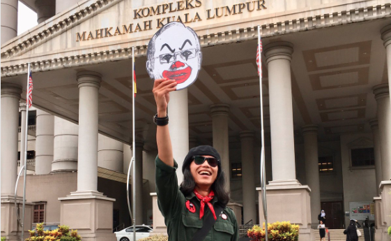 Artist Fahmi Reza, celebrating outside court via Fahmi Reza Twitter