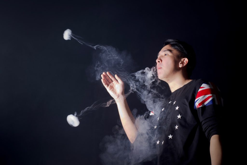 Osel Chandra, 21, demonstrates some of his vape cloud tricks inside a vape shop in Tangerang, Banten province, Indonesia. Photo: Reynold Sumayku