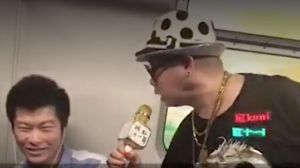 “Brother Ken” unsuccessfully tries to serenade a passenger on the MTR. Via Apple Daily