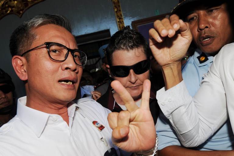 Renae Lawrence (C) of Australia is escorted from Bangli prison after being released in Bangli regency on Bali island on November 21, 2018. The first member of the “Bali Nine” heroin-trafficking gang was released from prison on November 21 after serving 13 years, in a case that caused a huge diplomatic rift between Indonesia and Australia. Photo: Sonny Tumbelaka/AFP