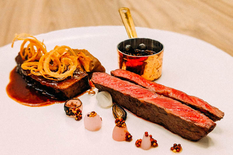 Common Man Stan’s Brisket and Try-Tip with celeriac and black garlic purée, pickled onions and mustard sauce. Photo: Coconuts Media