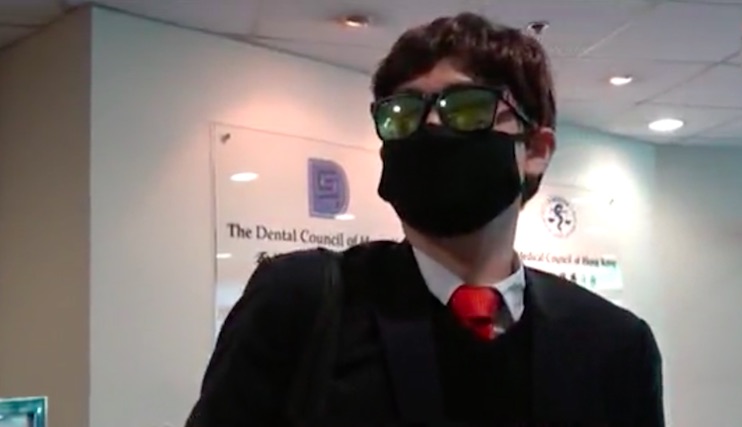 Wong Chi-chung outside the Hong Kong Medical Council, where he had his medical license suspended for four months after he pleaded guilty to taking upskirt photos and videos of nurses at Tuen Mun Hospital. Screengrab via Apple Daily video.