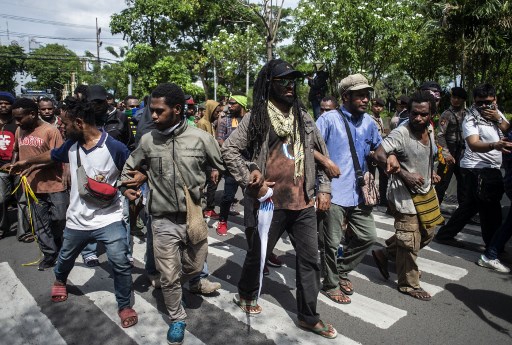 Papuans take part on a parade in Surabaya, East Java province, on December 1, 2018, during a commemoration of the independence day of Papua from Dutch colonial, which is then commemorated every year by separatists as a symbol of their freedom from Indonesia. (Photo by JUNI KRISWANTO / AFP)