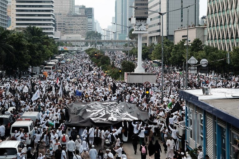 Thousands of Indonesian Islamists attend a rally in Jakarta on December 2, 2018, to commemorate the second anniversary of a demonstration which led to the fall of Jakarta’s then Christian governor Basuki Tjahaja Purnama. (Photo by PRANANDITYA / AFP)