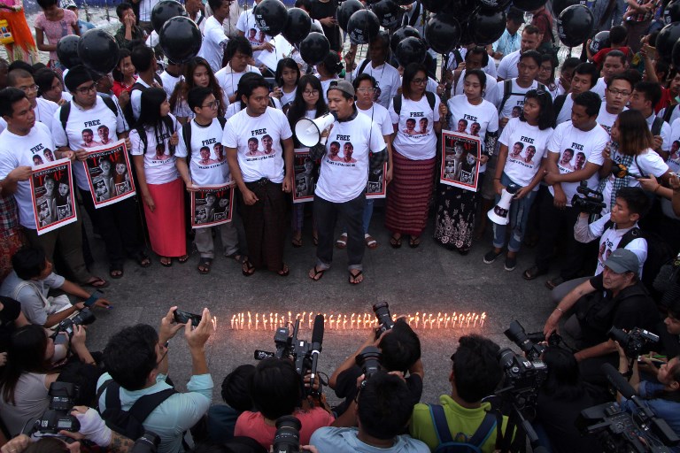 Myanmar supporters of jailed Reuters journalists Wa Lone and Kyaw Soe Oo holds a rally in Yangon on December 12, 2018 demanding their freedom. – Messages of solidarity poured in December 12 from around the world on the one-year anniversary of the arrest of two Myanmar Reuters journalists who exposed a massacre of Rohingya Muslims in Rakhine state. (Photo by Myo Kyaw SOE / AFP)
