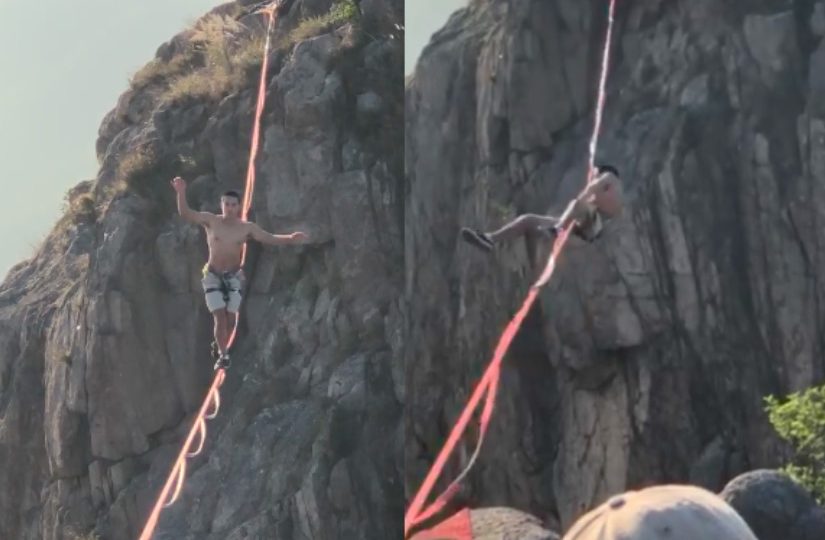 A topless man was caught on camera navigating a tight rope on Lion Rock. Screengrabs via Facebook video.
