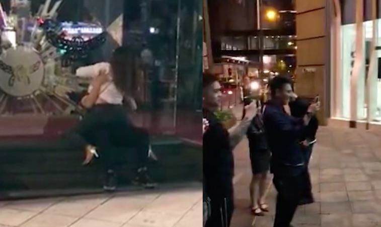 Couple caught on camera dry humping outside a storefront in Lan Kwai Fong. Screengrab via Apple Daily video.