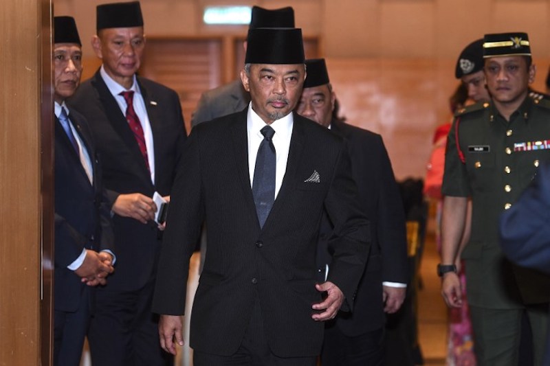 This picture taken on January 11, 2019 shows Tengku Abdullah Shah (centre) walking after a meeting in Kuala Lumpur. (Photo by AFP)