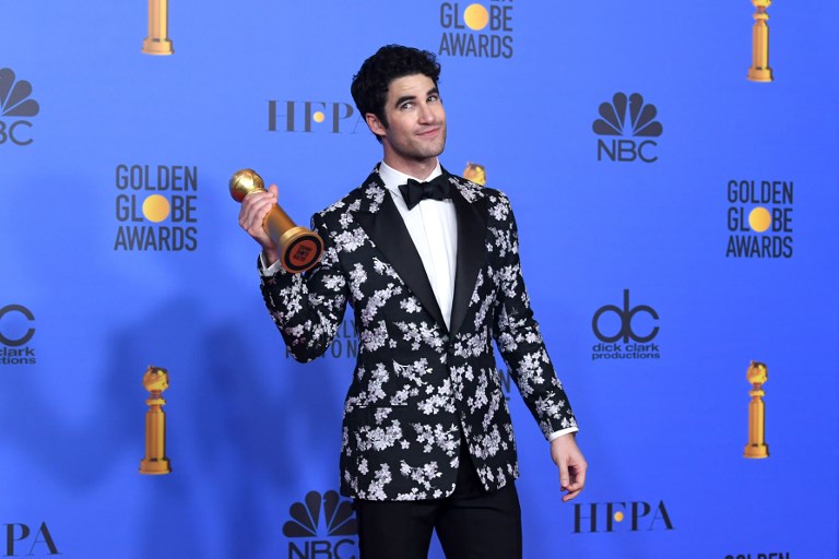 Darren Criss wins a Golden Globe for Best Performance by an Actor in a Limited Series or Motion Picture Made for Television for ‘The Assassination of Gianni Versace.” (Photo: Kevin Winter, Getty Images via AFP) 