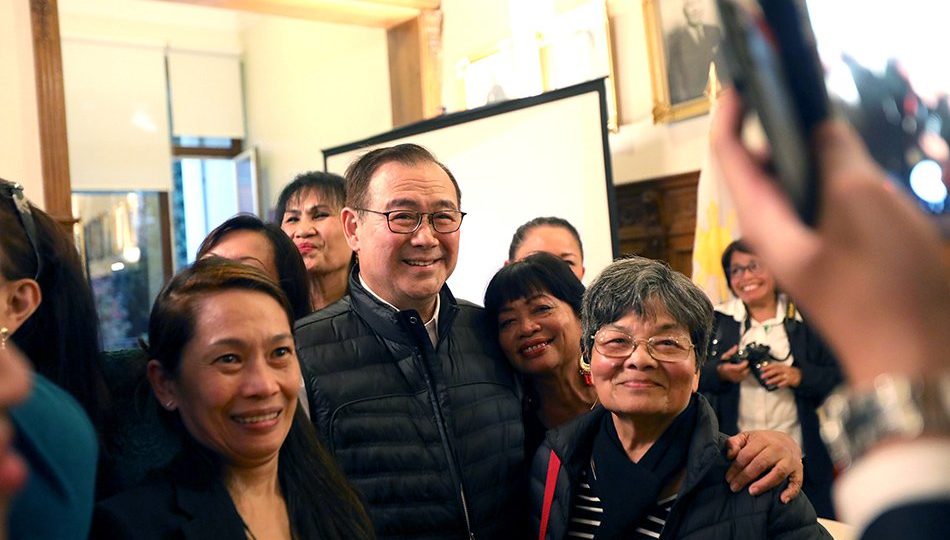 Teddy Locsin Jr. with Belgium-based Filipinos. Photo: Malacañang Palace/ABS-CBN News