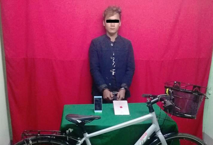 Suspect pictured with evidence – via Yangon Police Facebook page