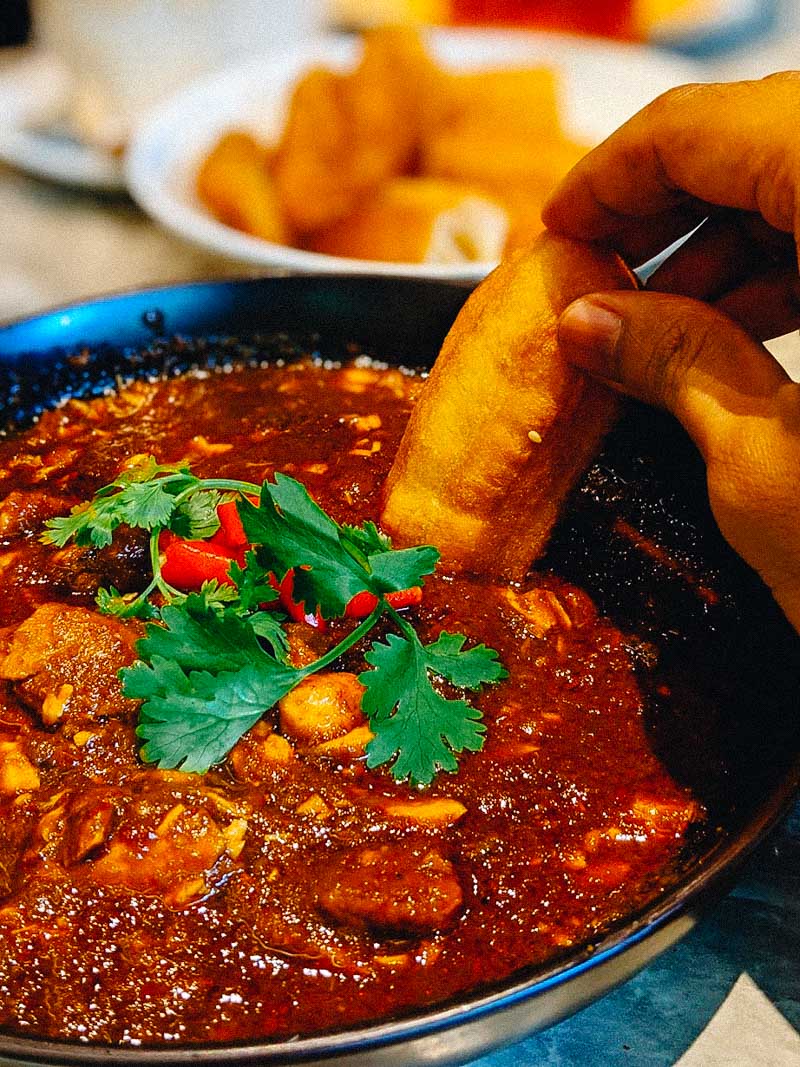 Garang Assam with You Tiao. Photo: Coconuts Media