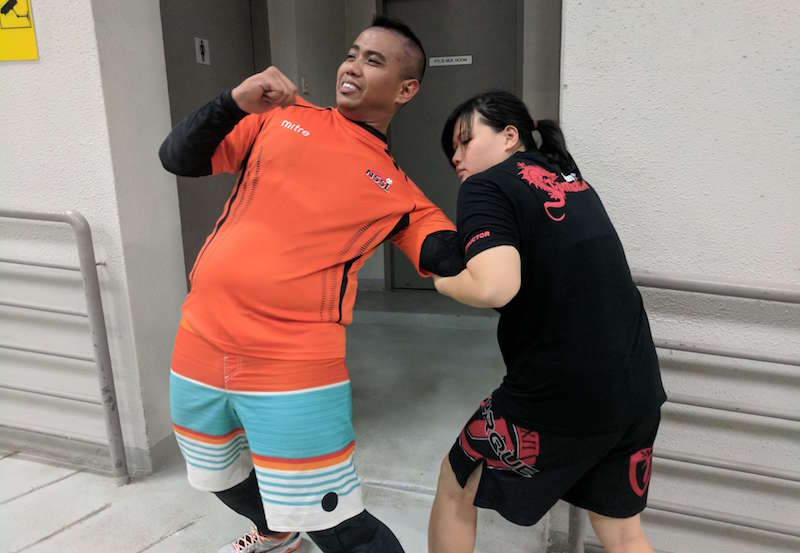 Taking down an 'attacker'. Photo: Qiu Yunquan/Kapap Academy