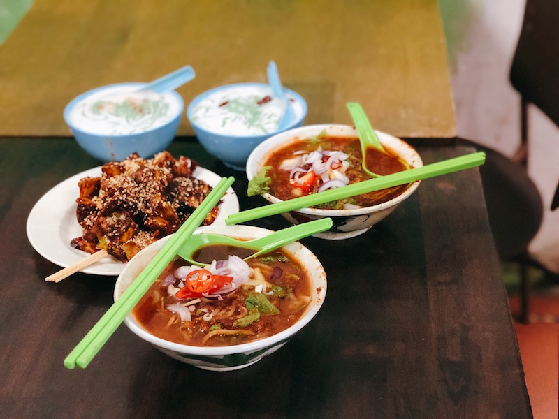 Bowls of chendol, rojak, and assam laksa. Photo: Coconuts Media