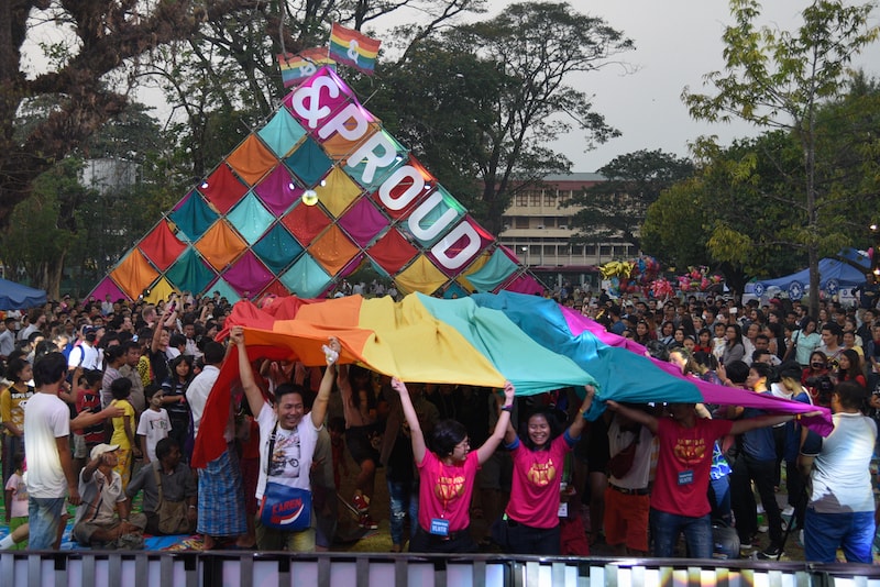 Pride revellers waving the rainbow flag during the Myanmar pride festival (Photo: Thet Htoo / &PROUD)