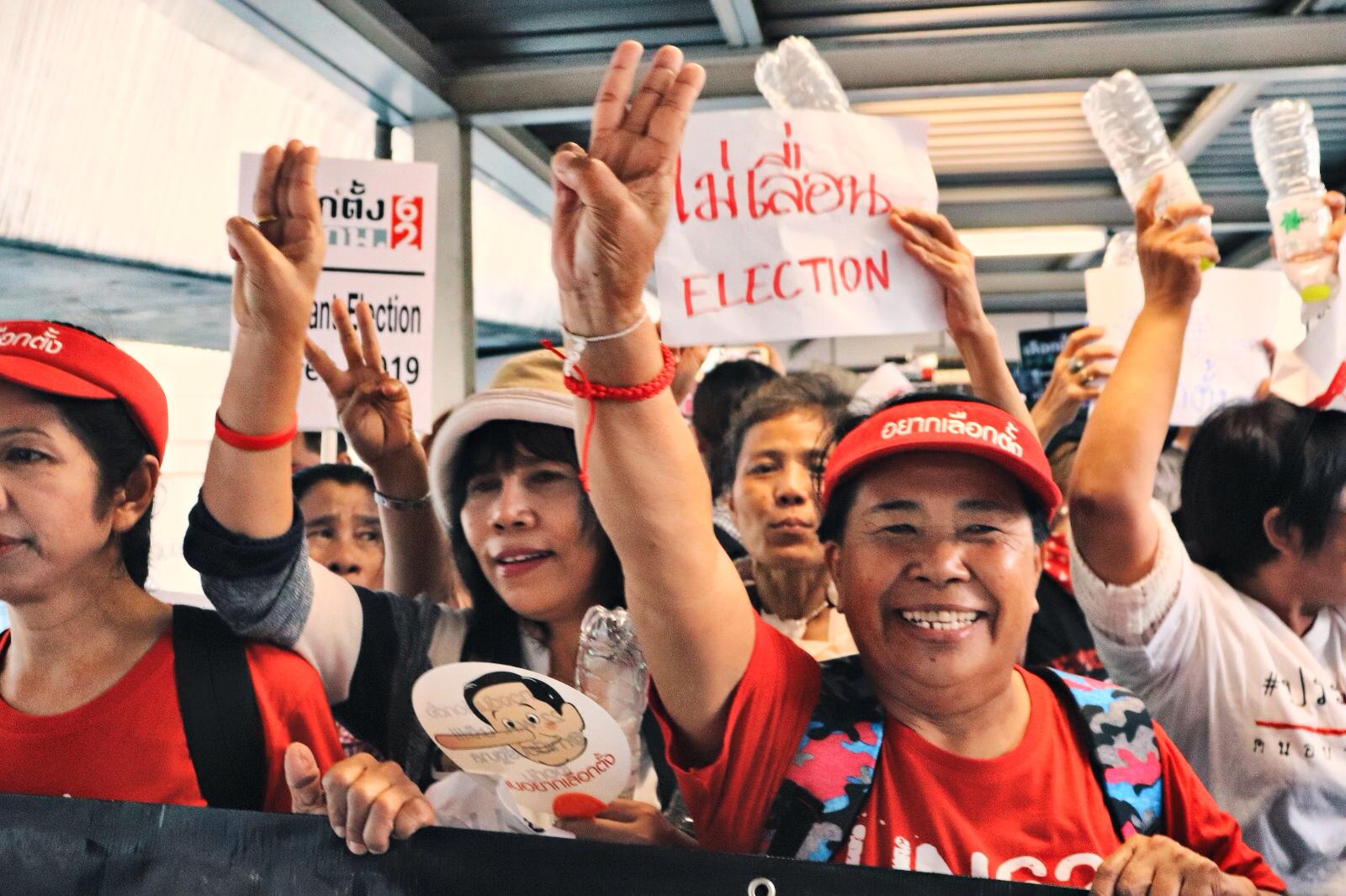 Pro-election protestors using the “Hunger Games” salute. Photo: Teirra Kamolvattanavith/ Coconuts Media