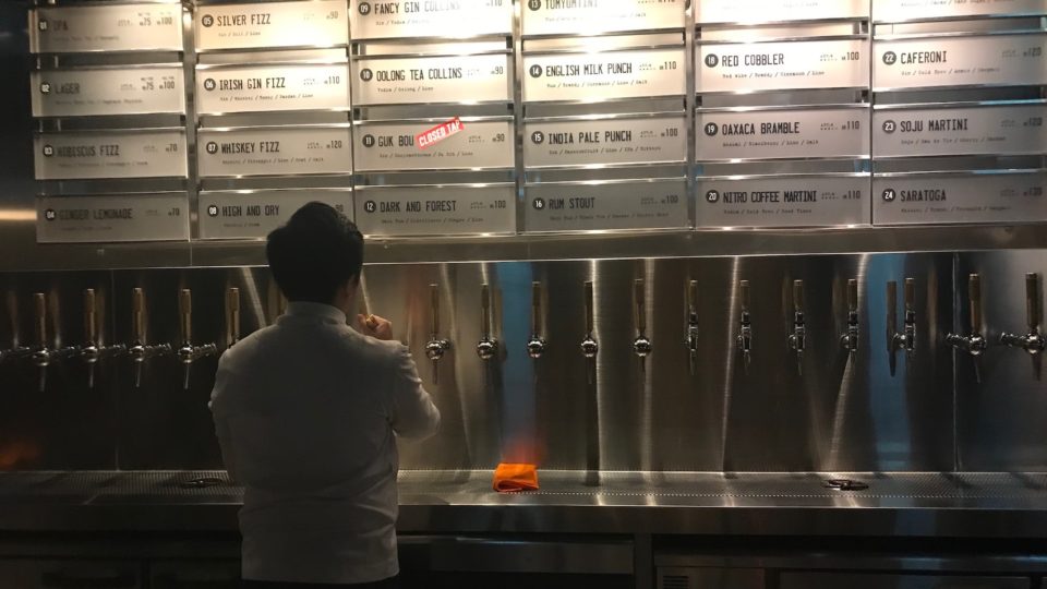 A bartender pulls a draft cocktail at Draft Land on Wyndham Street. Photo: Coconuts HK