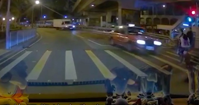 Dash cam footage shows the moment a 72-year-old woman was knocked over by a taxi that drove through a red light. Screengrab via Apple Daily video.