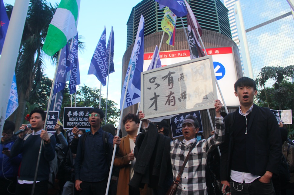Pro-independence activists end their march outside Admiralty Centre. Baggio Leung (far right), a spokesperson for the Hong Kong National Front told reporters that there had been a break in at the organisation's storage room in Tsuen Wan. Photo by Vicky Wong.