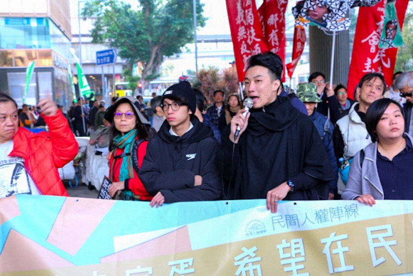 Jimmy Shan (second from left) at the annual New Year's Day rally. Photo by Coco Gao.