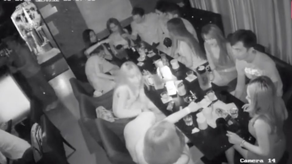 CCTV footage shows undercover cops pretending to be paying customers play a “grab breasts” game with some Thai girls working at a bar. Shortly after this, they arrested 33 people at the bar, including the bar’s manager. Screengrab via Apple Daily video.