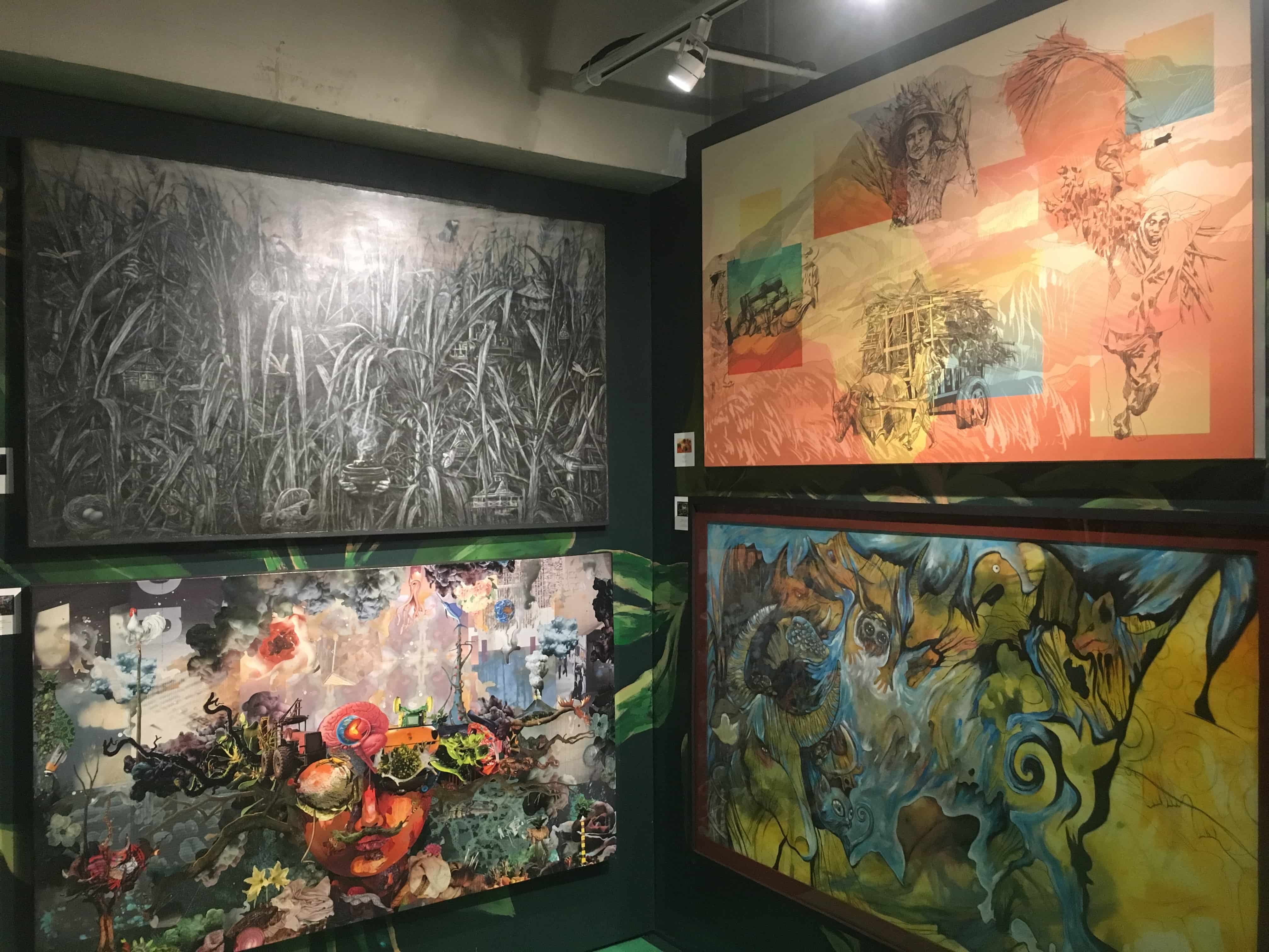 Paintings in Don Papa Rum's booth. (Photo: Therese Reyes)