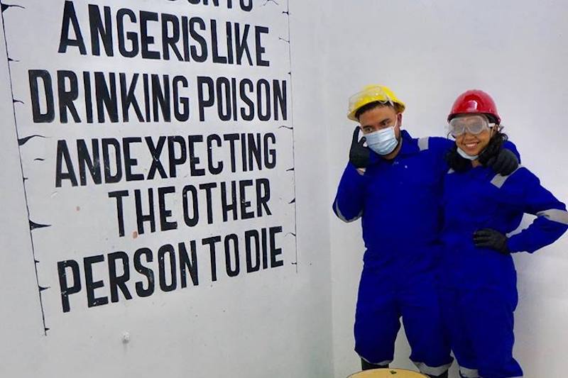 Patrons of Temper Clinic relieve stress and unleash their anger by smashing bottles and television sets in a rage room while wearing protective gear (Photo: Temper Clinic / Facebook)