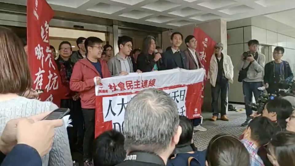 Long Hair Standing outside the Court of Appeal with Nathan Law (left) and Edward Yiu (right). Screengrab via Facebook video/League of Social Democrats.