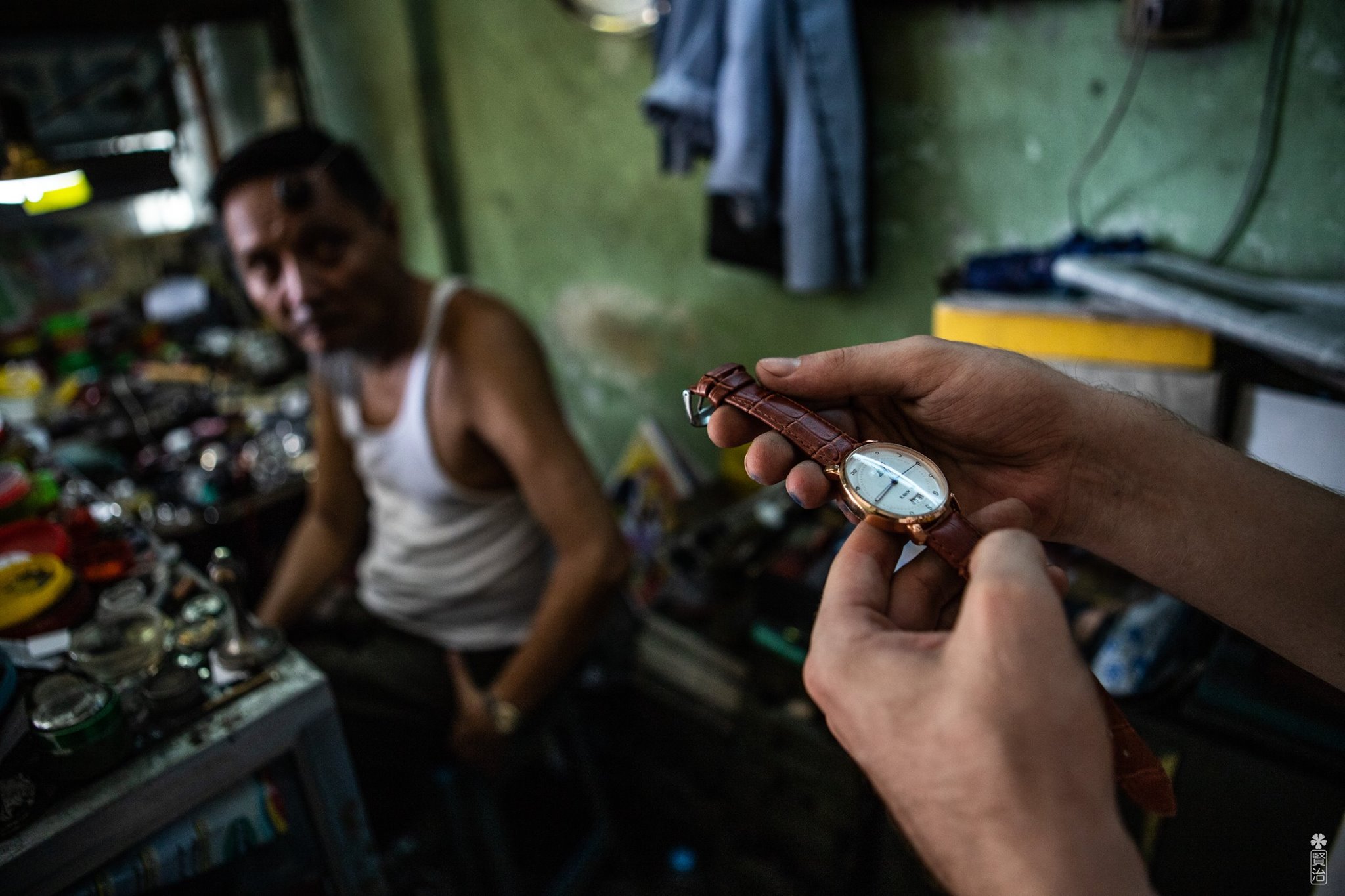 Ko Kyaw Oo sitting behind his work station. Photo: Burma Watches / Hae Thaw Htet.