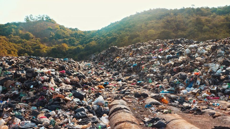 An enormous garbage pile in Koh Lan matches the mountain range behind it. Photo: Ajith Srinivasan/ Coconuts Media
