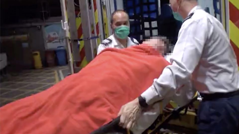 A drunk Dutch man is taken to Queen Elizabeth Hospital in a semi-conscious state after punching through a bar’s bathroom window. Screengrab via Apple Daily video.