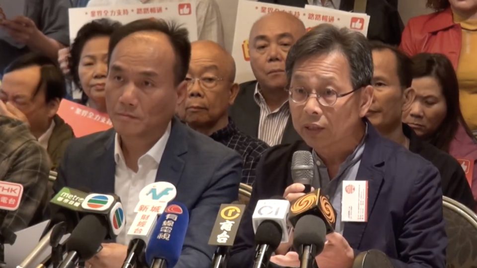 Hong Kong Taxi Council Chairman Hung Wing-tat (right) at a press conference announcing that they will be launching a taxi-hailing app to rival Uber. Screengrab via YouTube.