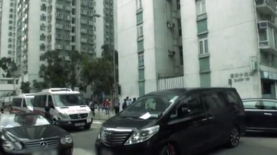 A Mercedes Benz, Toyota, and Lexus all owned by the same man block a road near a housing estate after the owner of all three cars had one of them clamped. Screengrab via Apple Daily video.