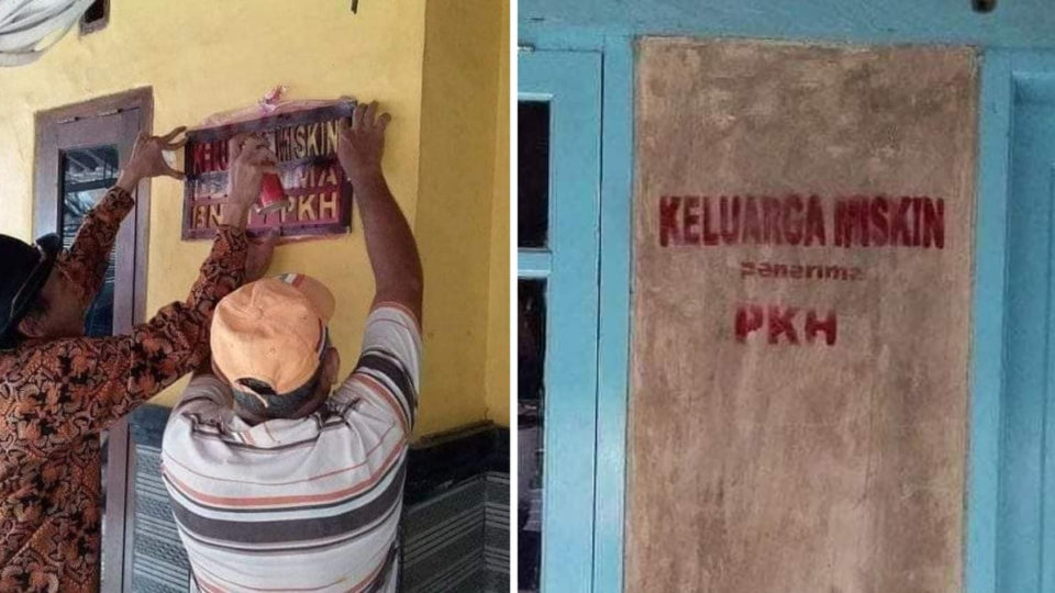 Officials using a stencil to write the words “Keluarga Miskin” (Poor Family). Photo: Ariez Suryanto