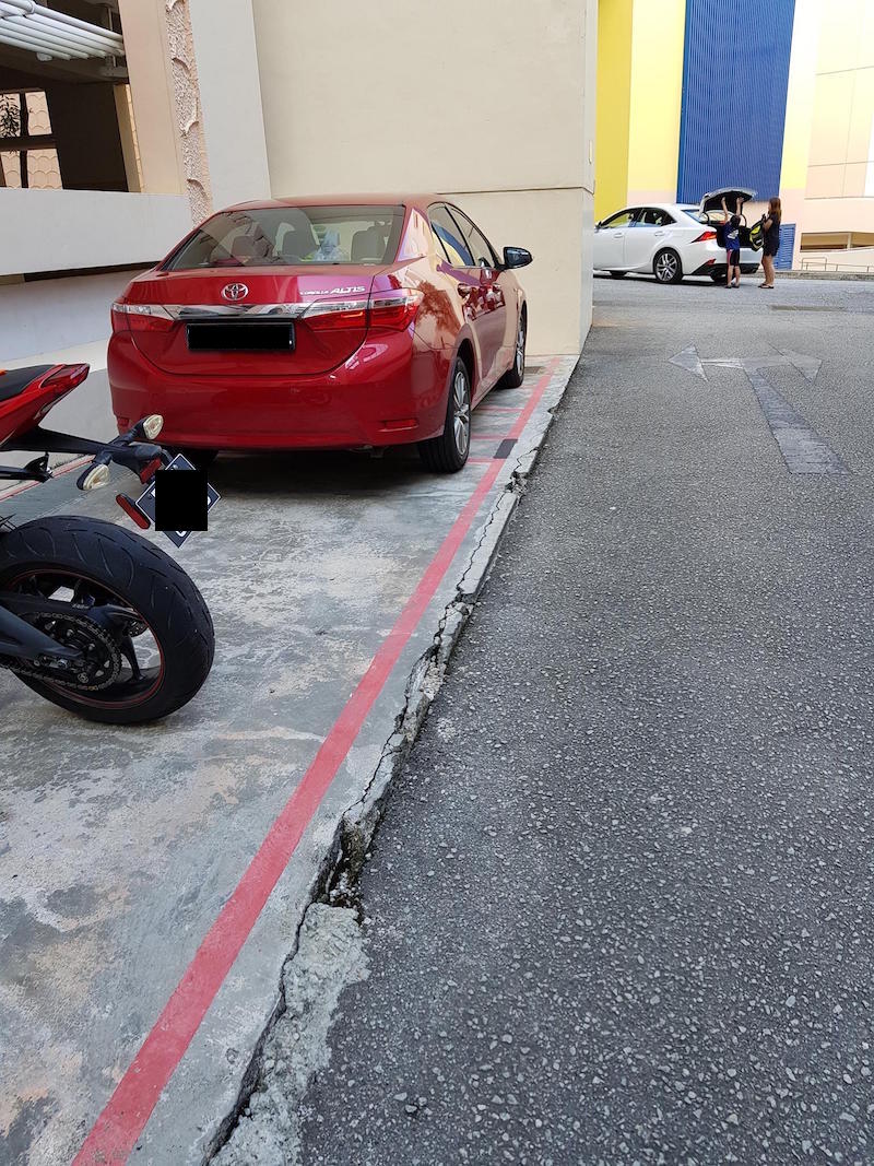 'Another one who needs a condom, coz it took up all the bike lots & I've got no choice but to take a car lot. Mind you, I paid for the Reserved bike lot.' Photo: Meng Yang/Facebook