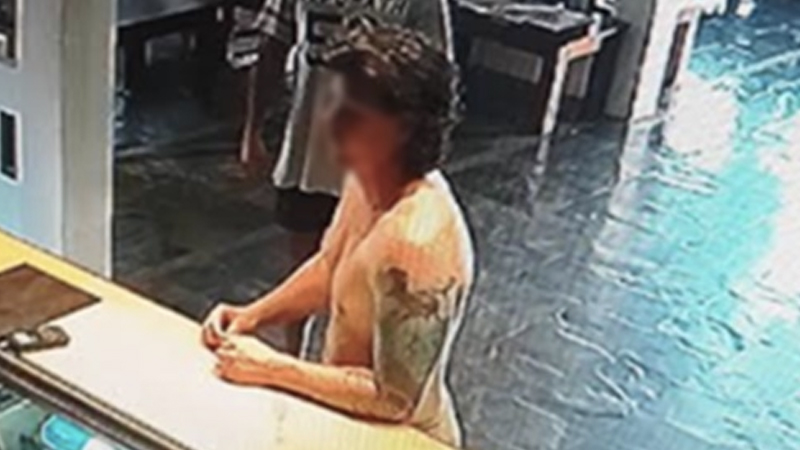 ‘Where am I?’ the suspected American boat bandit reportedly asked at his hotel’s reception desk, seen here in CCTV-vision. 