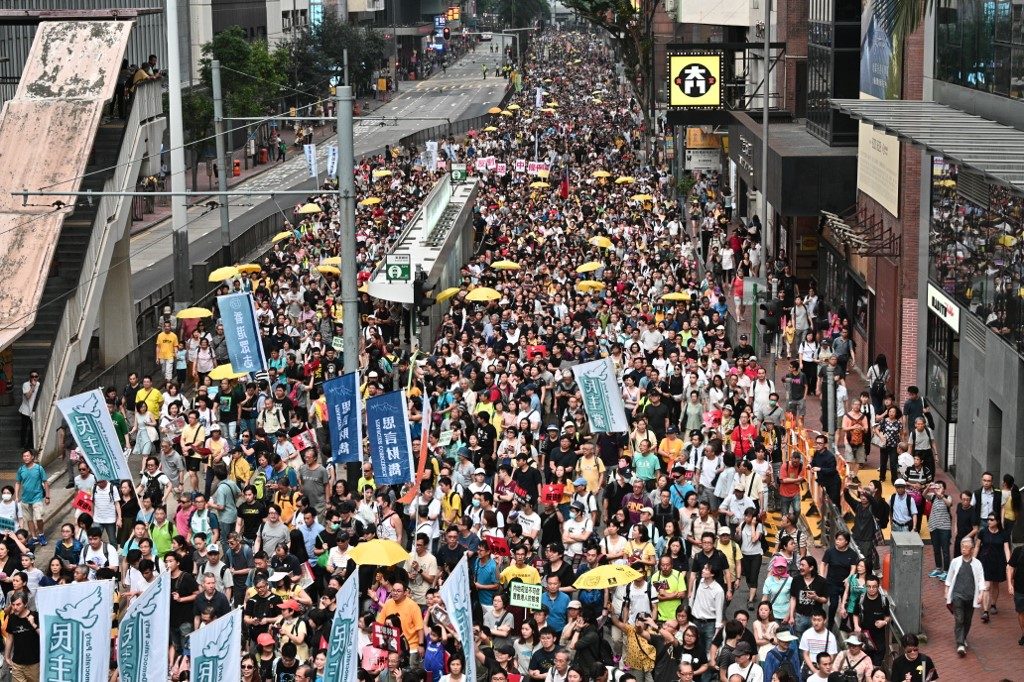 Activists protest a controversial plan by Hong Kong's government to allow extraditions to the Chinese mainland on Sunday. Photo via AFP.