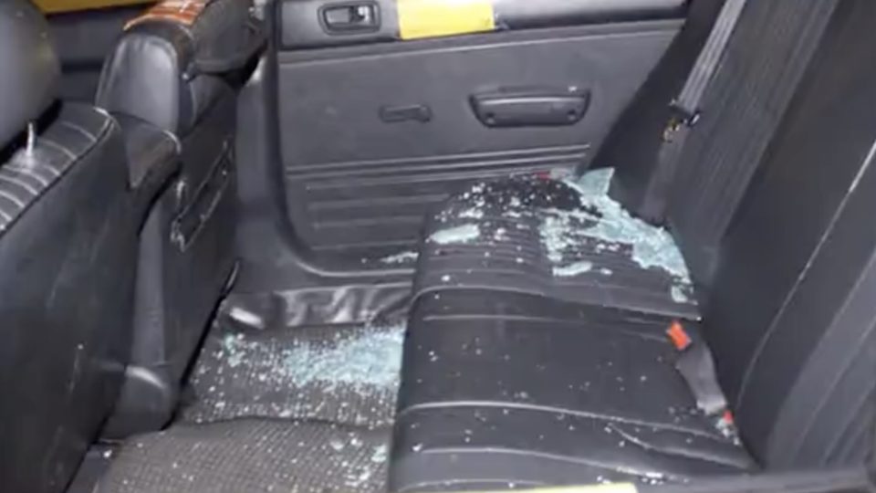 The inside of a cab that got caught up in a carjacking that saw two men stabbed in the middle of the road. Screengrab via Apple Daily video.