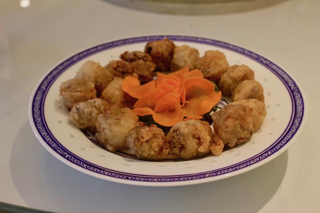 Man Hing's deep-fried caul fat rolls stuffed with shredded pork and eel. Photo by Vicky Wong.